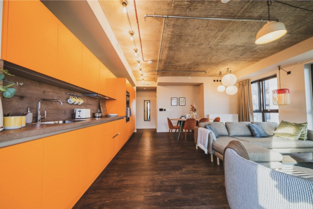Kitchen and lounge area at The Robinson - Quintain Living | PBSA News