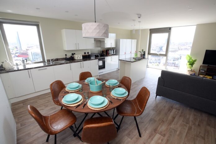 Shared kitchen and living area in an apartment at LIV Student Belfast - Valeo Management Europe | GRAHAM | PBSA News Shared kitchen and living area in an apartment at LIV Student Belfast - Valeo Management Europe | GRAHAM | PBSA News