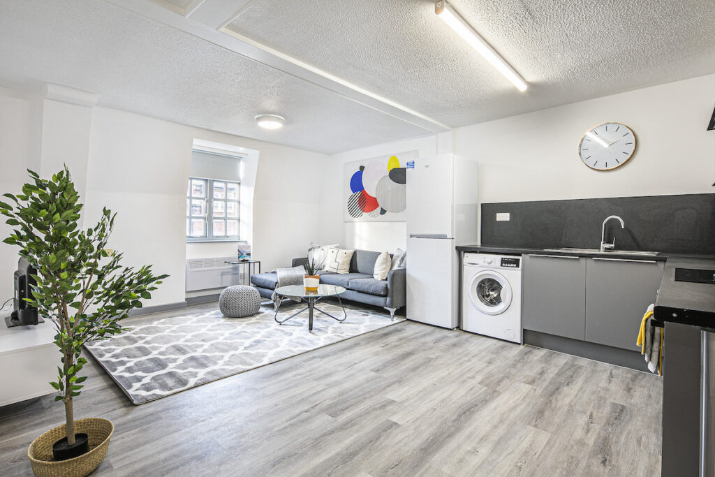 Reconfigured and refurbished kitchen leading to lounge at Phoenix Court - Resify | L1 Property | PBSA News
