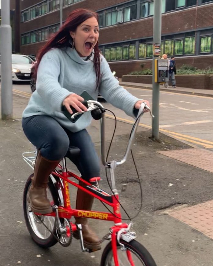 Kexgill's Nottingham manager Holly Van de Velde riding a Raleigh Chopper, celebrating the forward letting of the operators new Raleigh House PBSA in Nottingham | The Kexgill Group | University Quarter | PBSA News Kexgill's Nottingham manager Holly Van de Velde riding a Raleigh Chopper, celebrating the forward letting of the operators new Raleigh House PBSA in Nottingham | The Kexgill Group | University Quarter | PBSA News