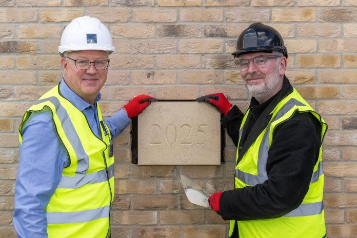 Pictured: Derek Quinn, Executive Director at RED Construction and David Campbell, CEO at Alumno at the Hollis Wharf topping out ceremony in Bath | PBSA News Pictured: Derek Quinn, Executive Director at RED Construction and David Campbell, CEO at Alumno at the Hollis Wharf topping out ceremony in Bath | PBSA News